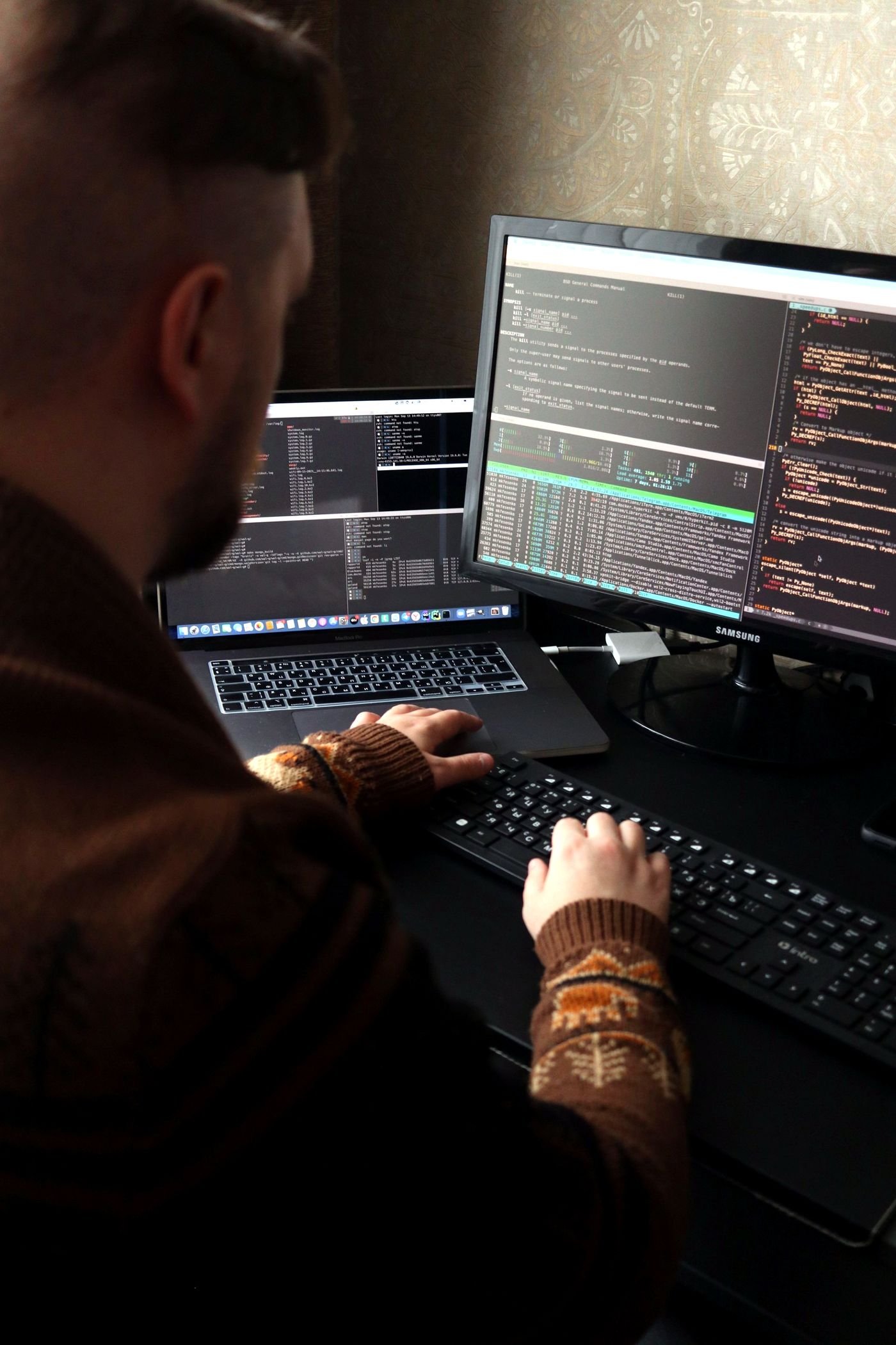 Engineer working across dark-mode development environments