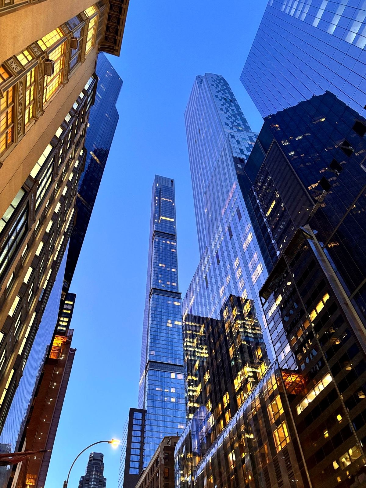 Modern high-rise office towers under a clear blue sky, representing scalable growth